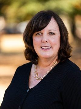 Karen Carpenterheadshot a member of Student Services with a black top on.