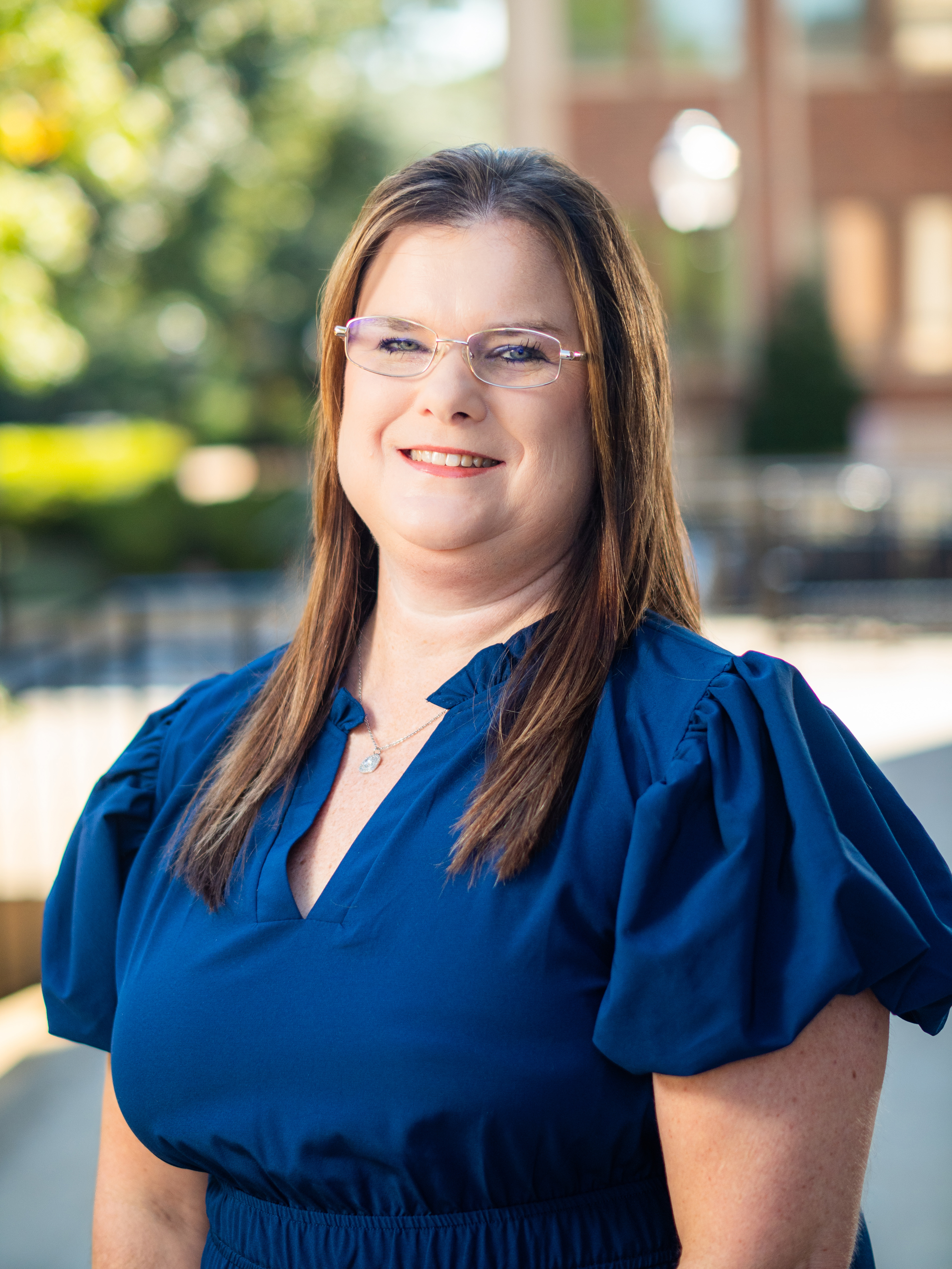 Shelley Michaels headshot a member of Student Services with a blue top on.
