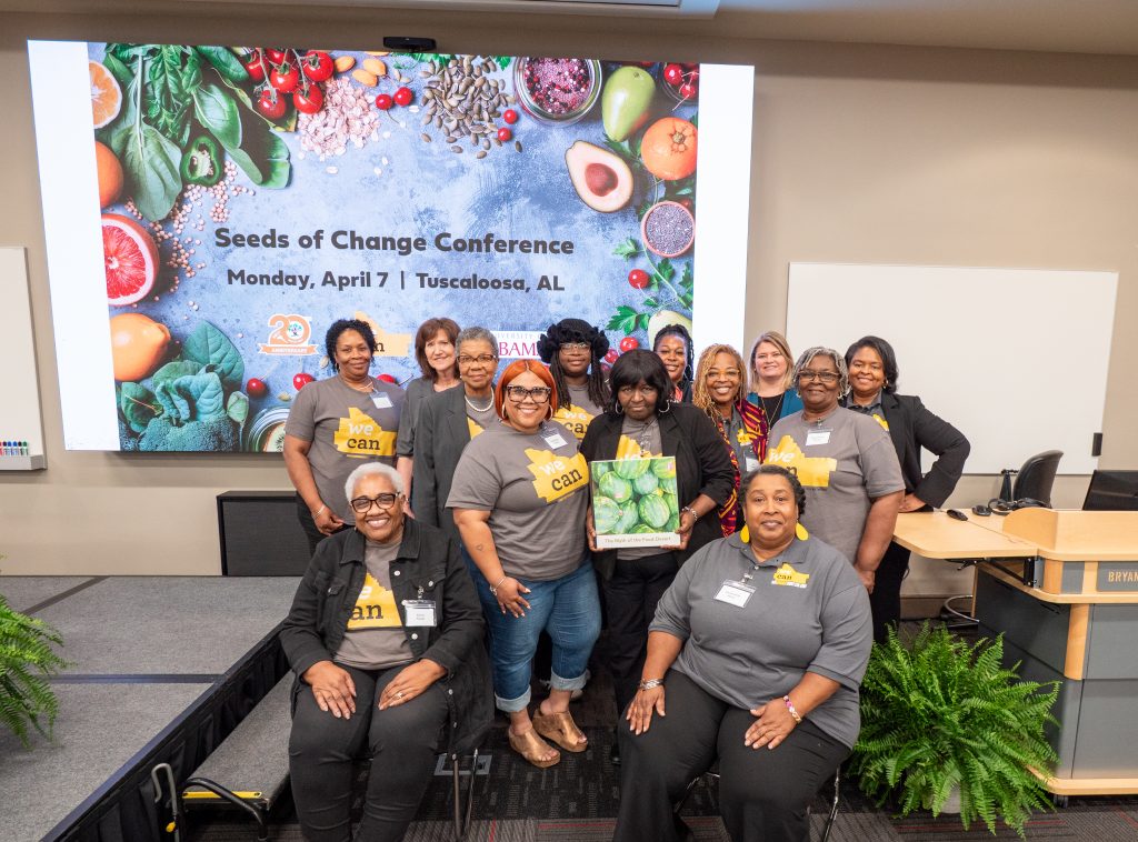 A group of people posing at a conference